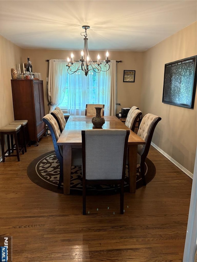 32 Northgate, Wanaque, NJ 07465 - dining room featuring a chandelier, wood finished floors, and baseboards