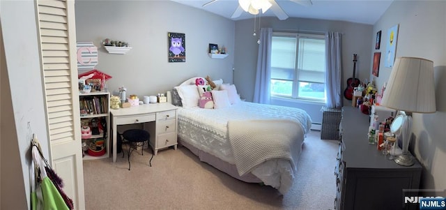 32 Northgate, Wanaque, NJ 07465 - bedroom with light carpet, vaulted ceiling, a baseboard radiator, and ceiling fan