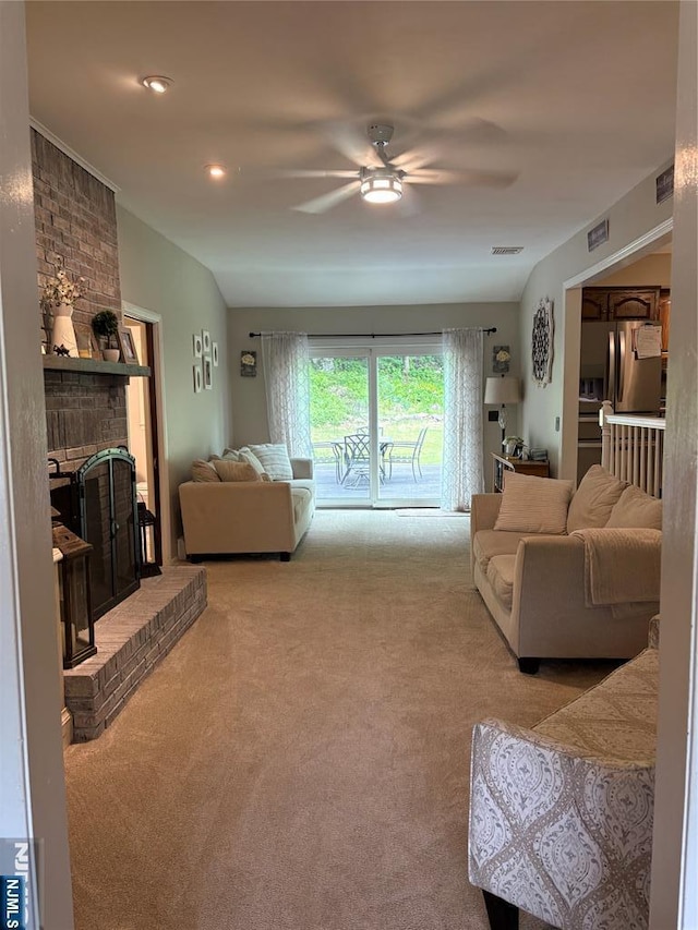 32 Northgate, Wanaque, NJ 07465 - living area featuring carpet floors, ceiling fan, and a brick fireplace