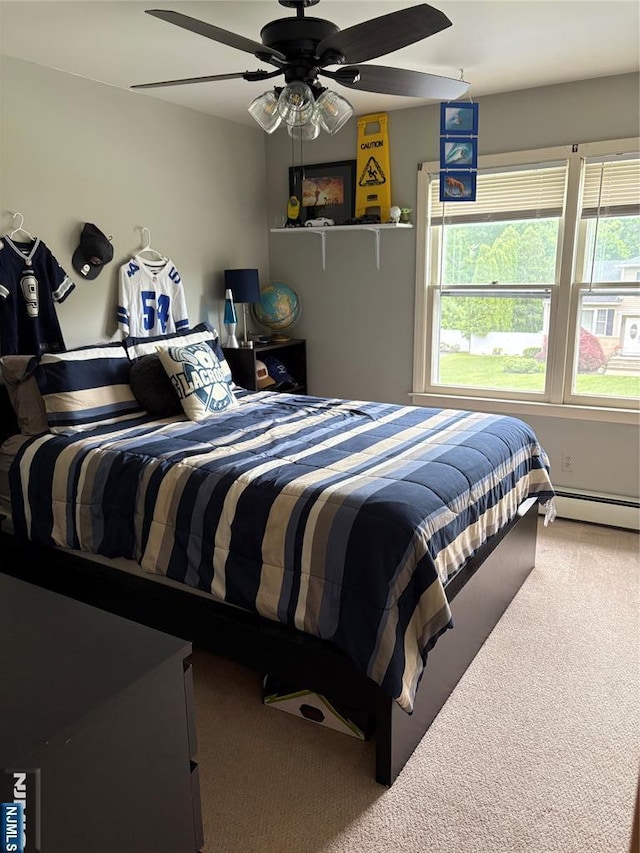 32 Northgate, Wanaque, NJ 07465 - carpeted bedroom with multiple windows, baseboard heating, and ceiling fan