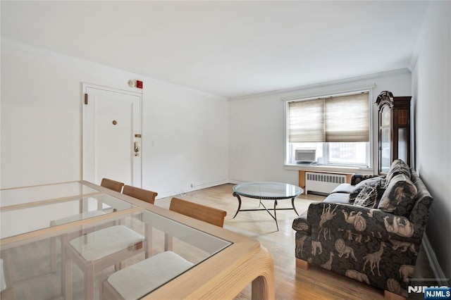 2350 Linwood Ave Unit 4D, Fort Lee, NJ 07024 - living area with radiator heating unit, crown molding, and light wood finished floors