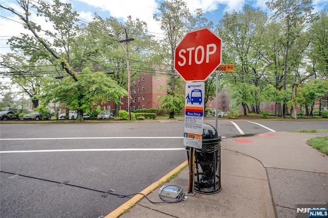 2350 Linwood Ave Unit 4D, Fort Lee, NJ 07024 - view of asphalt road with traffic signs, sidewalks, and curbs