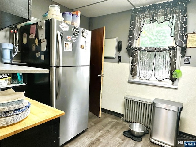 84 Haring St, Bergenfield, NJ 07621 - kitchen featuring radiator, freestanding refrigerator, wood finished floors, and wooden counters