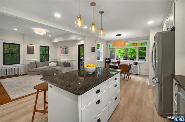 246 Park Ave, Allendale, NJ 07401 - kitchen featuring radiator heating unit, freestanding refrigerator, plenty of natural light, light wood-style floors, and recessed lighting