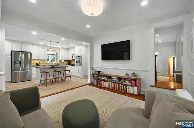 246 Park Ave, Allendale, NJ 07401 - living room featuring light wood finished floors, crown molding, recessed lighting, and baseboards