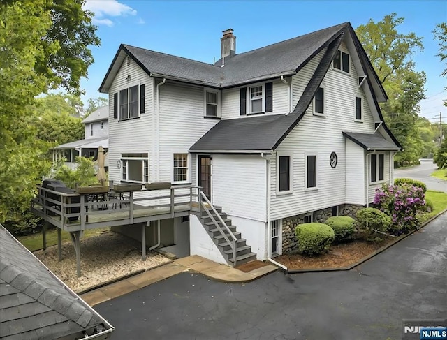 246 Park Ave, Allendale, NJ 07401 - rear view of property featuring a chimney, a wooden deck, stairs, and a shingled roof