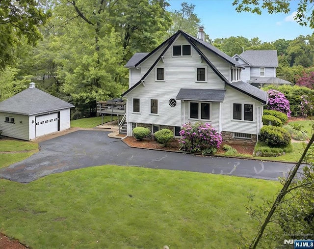 246 Park Ave, Allendale, NJ 07401 - view of front of home featuring an outdoor structure, a garage, a front yard, a chimney, and a deck