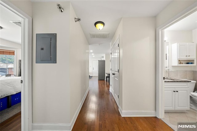 270 Grand Ave Unit 4E, Palisades Park, NJ 07650 - hallway featuring electric panel, light wood-style floors, and baseboards