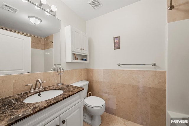 270 Grand Ave Unit 4E, Palisades Park, NJ 07650 - full bathroom with tile walls, toilet, vanity, tile patterned floors, and a shower