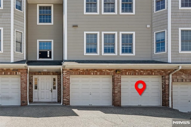 270 Grand Ave Unit 4E, Palisades Park, NJ 07650 - view of exterior entry with brick siding and a garage