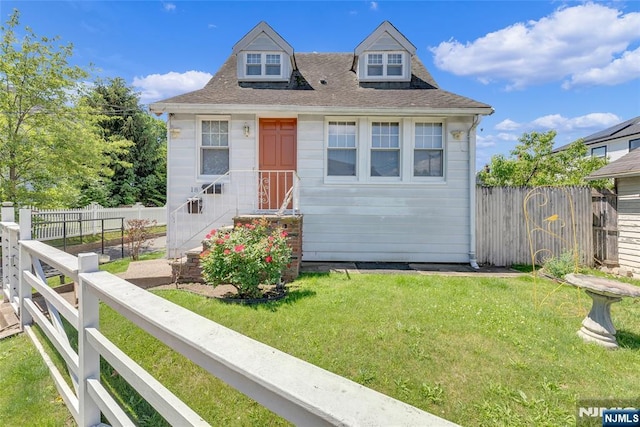 18 Tromp St, Clifton, NJ 07011 - view of front of house featuring a shingled roof, entry steps, and central AC