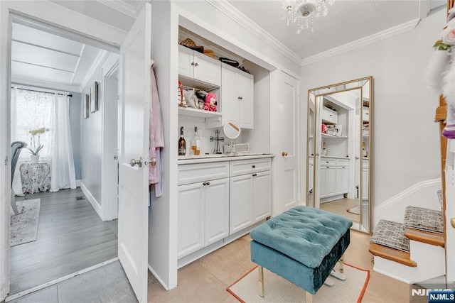 18 Tromp St, Clifton, NJ 07011 - bar featuring ornamental molding, light tile patterned floors, and baseboards