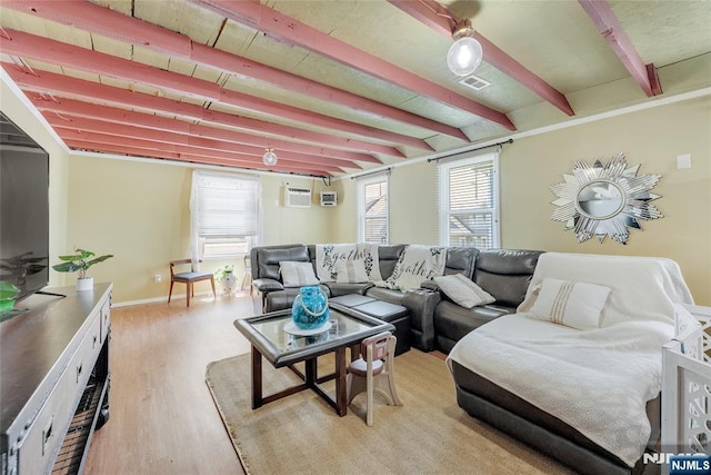 18 Tromp St, Clifton, NJ 07011 - living area featuring beam ceiling, light wood-type flooring, baseboards, and a wall mounted AC