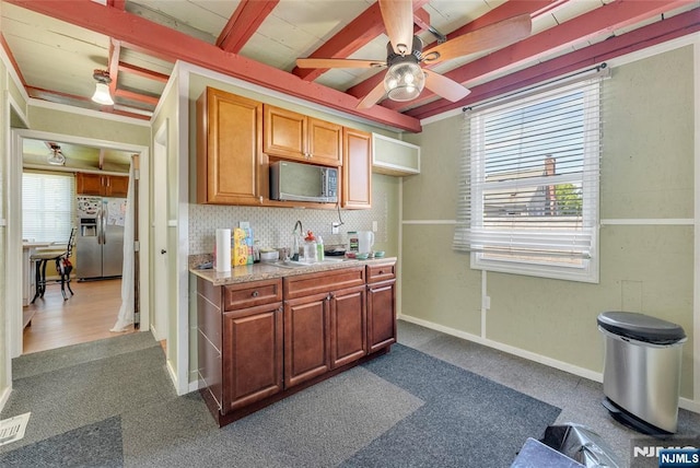 18 Tromp St, Clifton, NJ 07011 - kitchen with appliances with stainless steel finishes, plenty of natural light, dark carpet, ceiling fan, and beam ceiling