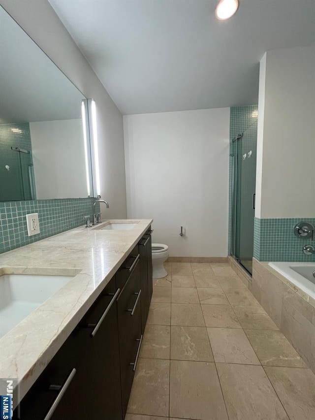615 Hudson Park, Edgewater, NJ 07020 - full bathroom featuring a garden tub, a shower stall, double vanity, toilet, and tile patterned floors