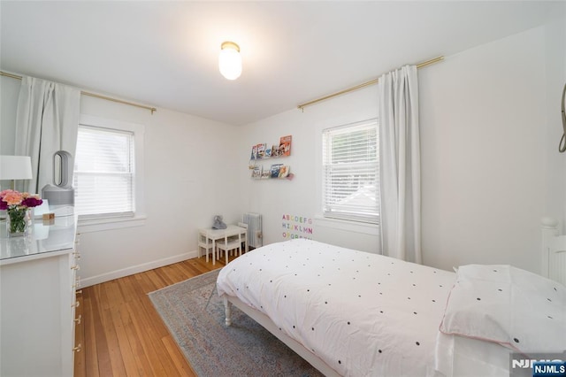 1096 Stasia St, Teaneck, NJ 07666 - bedroom with multiple windows, light wood-type flooring, and baseboards