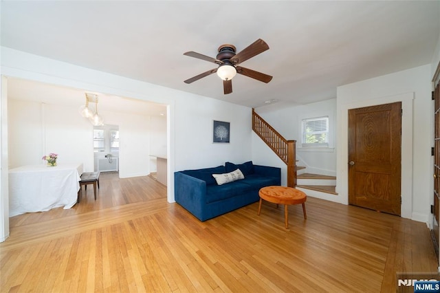 1096 Stasia St, Teaneck, NJ 07666 - living room with ceiling fan, light wood finished floors, and stairway