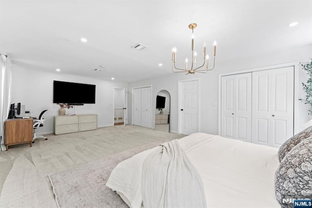 544 Jackson Ave, Twp Of Washington, NJ 07676 - bedroom featuring multiple closets, a chandelier, recessed lighting, light colored carpet, and arched walkways