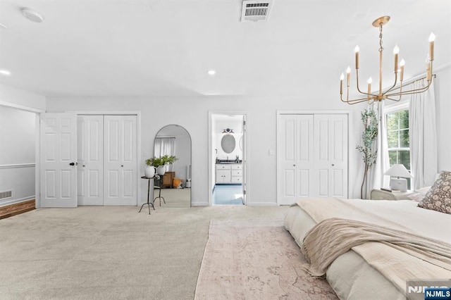 544 Jackson Ave, Twp Of Washington, NJ 07676 - carpeted bedroom featuring a chandelier, ensuite bath, multiple closets, baseboards, and recessed lighting