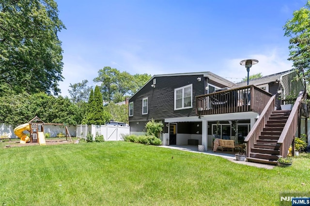 544 Jackson Ave, Twp Of Washington, NJ 07676 - back of house with a wooden deck, stairway, a playground, and a patio area