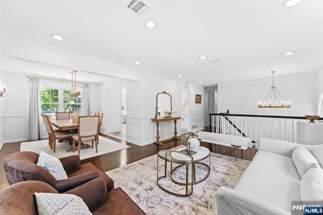 544 Jackson Ave, Twp Of Washington, NJ 07676 - living room with a chandelier, dark wood-style floors, a decorative wall, recessed lighting, and baseboards