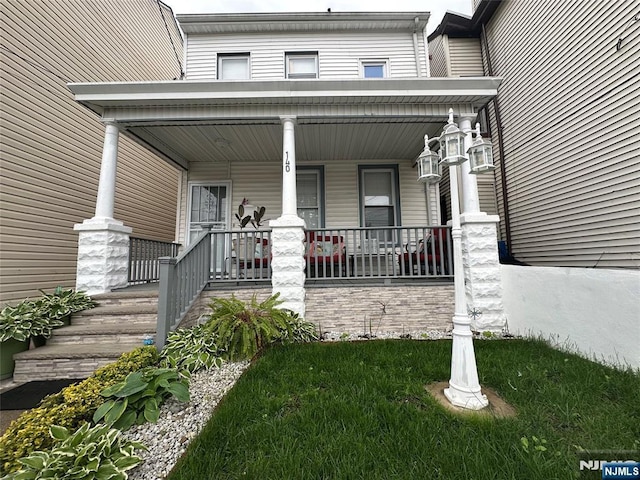 140 Oak St, Paterson, NJ 07501 - view of exterior entry with a porch