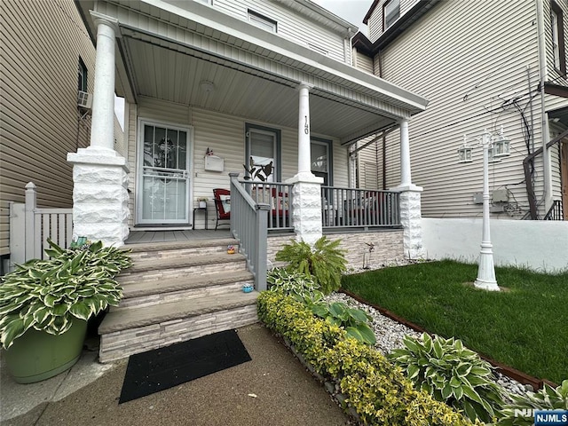 140 Oak St, Paterson, NJ 07501 - doorway to property with covered porch