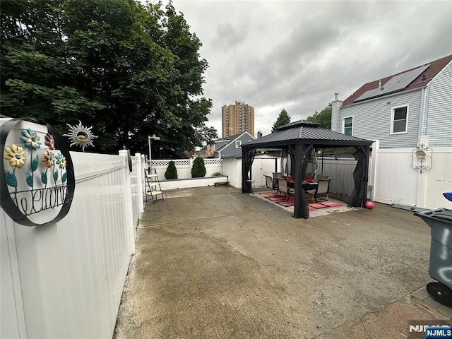140 Oak St, Paterson, NJ 07501 - fenced backyard featuring a gazebo and a patio
