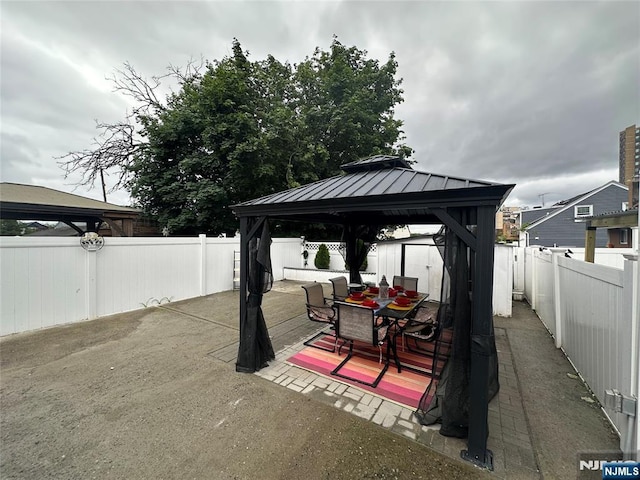 140 Oak St, Paterson, NJ 07501 - fenced backyard featuring a gazebo, outdoor dining space, and a deck
