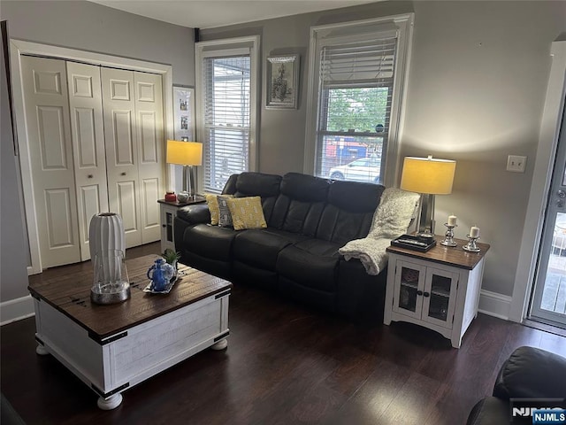 140 Oak St, Paterson, NJ 07501 - living room featuring dark wood-style flooring and baseboards