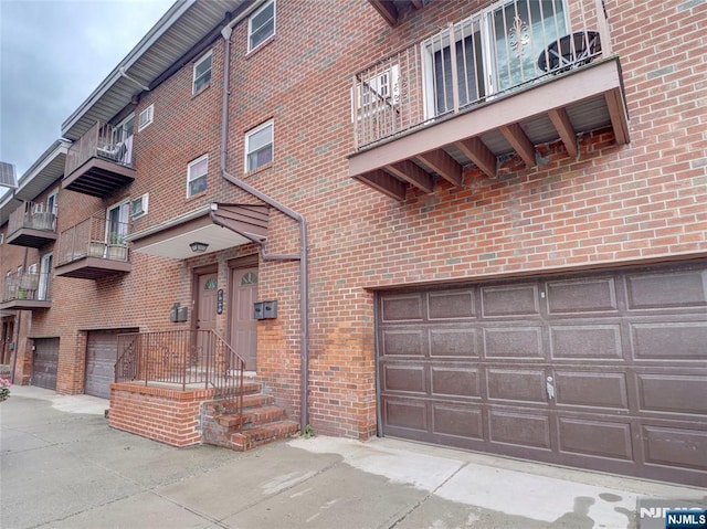 2200 Paterson Plank Rd Unit 19, North Bergen, NJ 07047 - view of property featuring a garage and driveway
