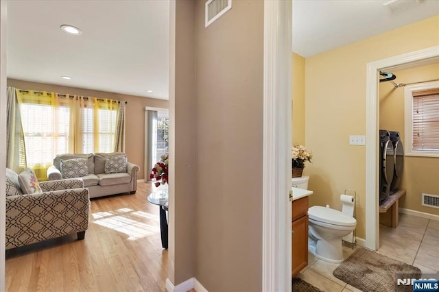 861 Birch St, Perth Amboy, NJ 08861 - living area with separate washer and dryer, baseboards, light wood-type flooring, and recessed lighting