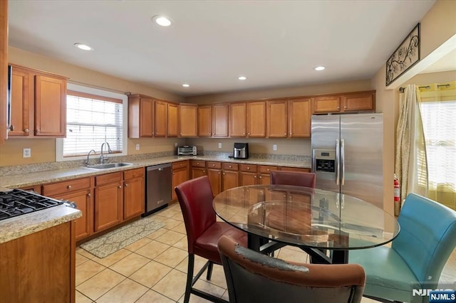 861 Birch St, Perth Amboy, NJ 08861 - kitchen with appliances with stainless steel finishes, a sink, light countertops, light tile patterned floors, and recessed lighting