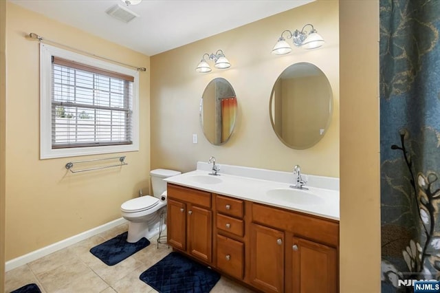861 Birch St, Perth Amboy, NJ 08861 - bathroom featuring double vanity, tile patterned flooring, toilet, and baseboards