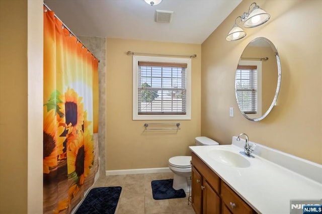 861 Birch St, Perth Amboy, NJ 08861 - bathroom with healthy amount of natural light, vanity, toilet, and tile patterned floors