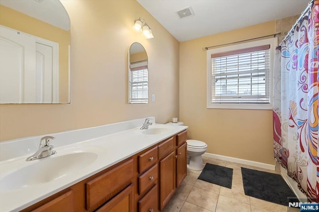 861 Birch St, Perth Amboy, NJ 08861 - bathroom with toilet, double vanity, tile patterned floors, a shower with curtain, and baseboards