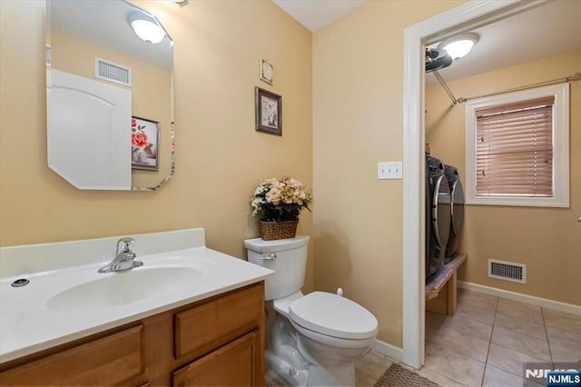 861 Birch St, Perth Amboy, NJ 08861 - bathroom featuring washing machine and dryer, toilet, vanity, tile patterned floors, and curtained shower