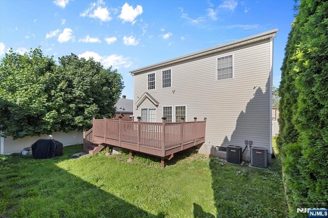 861 Birch St, Perth Amboy, NJ 08861 - rear view of house with a yard, central AC unit, and a deck