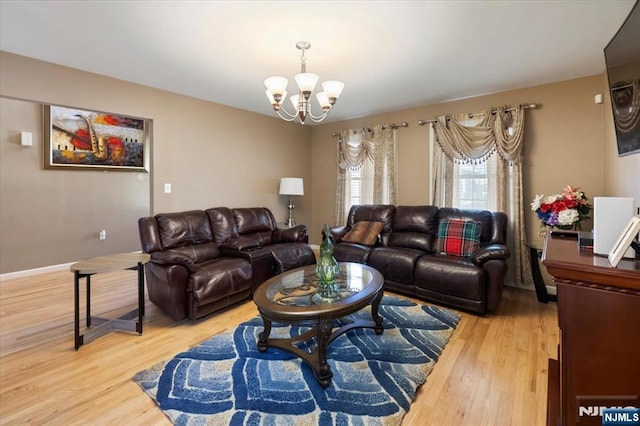 861 Birch St, Perth Amboy, NJ 08861 - living room featuring a chandelier and light wood-style flooring