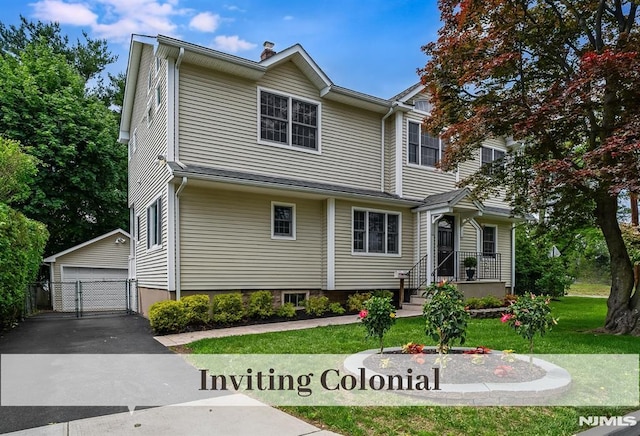 640 E Glen Ave, Ridgewood, NJ 07450 - traditional-style house featuring an outbuilding, a front lawn, and a garage
