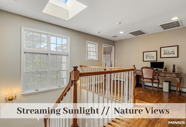 640 E Glen Ave, Ridgewood, NJ 07450 - corridor with wood finished floors, a skylight, recessed lighting, and an upstairs landing
