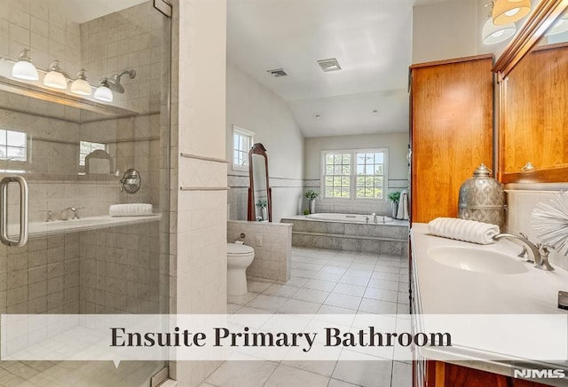 640 E Glen Ave, Ridgewood, NJ 07450 - bathroom featuring tile patterned floors, vanity, a bath, a stall shower, and vaulted ceiling