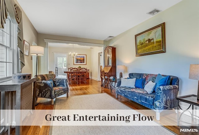 640 E Glen Ave, Ridgewood, NJ 07450 - living area featuring wood finished floors and a chandelier