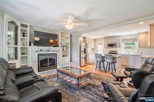 546 Atlas Rd, Roxbury Township, NJ 07850 - living area featuring crown molding, a fireplace, a ceiling fan, light wood-style flooring, and recessed lighting