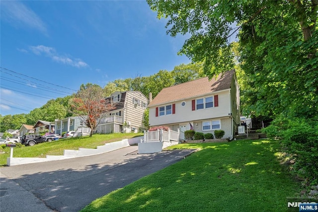 546 Atlas Rd, Roxbury Township, NJ 07850 - view of front of house featuring a front lawn, a residential view, and brick siding