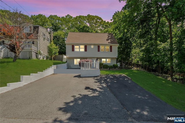 546 Atlas Rd, Roxbury Township, NJ 07850 - colonial-style house featuring a lawn and asphalt driveway