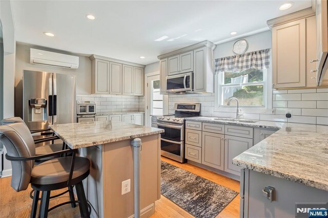 546 Atlas Rd, Roxbury Township, NJ 07850 - kitchen featuring appliances with stainless steel finishes, an AC wall unit, a sink, plenty of natural light, and recessed lighting