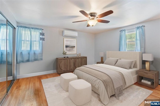 546 Atlas Rd, Roxbury Township, NJ 07850 - bedroom with a wall unit AC, light wood finished floors, a ceiling fan, and baseboards