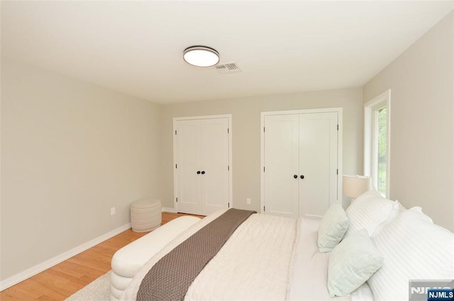 15-22 Radburn Rd, Fair Lawn, NJ 07410 - bedroom featuring light wood-style flooring and multiple closets