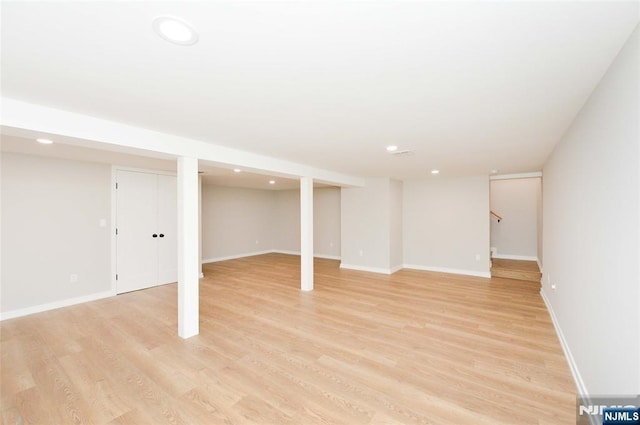 15-22 Radburn Rd, Fair Lawn, NJ 07410 - finished below grade area with light wood-type flooring, recessed lighting, and stairs